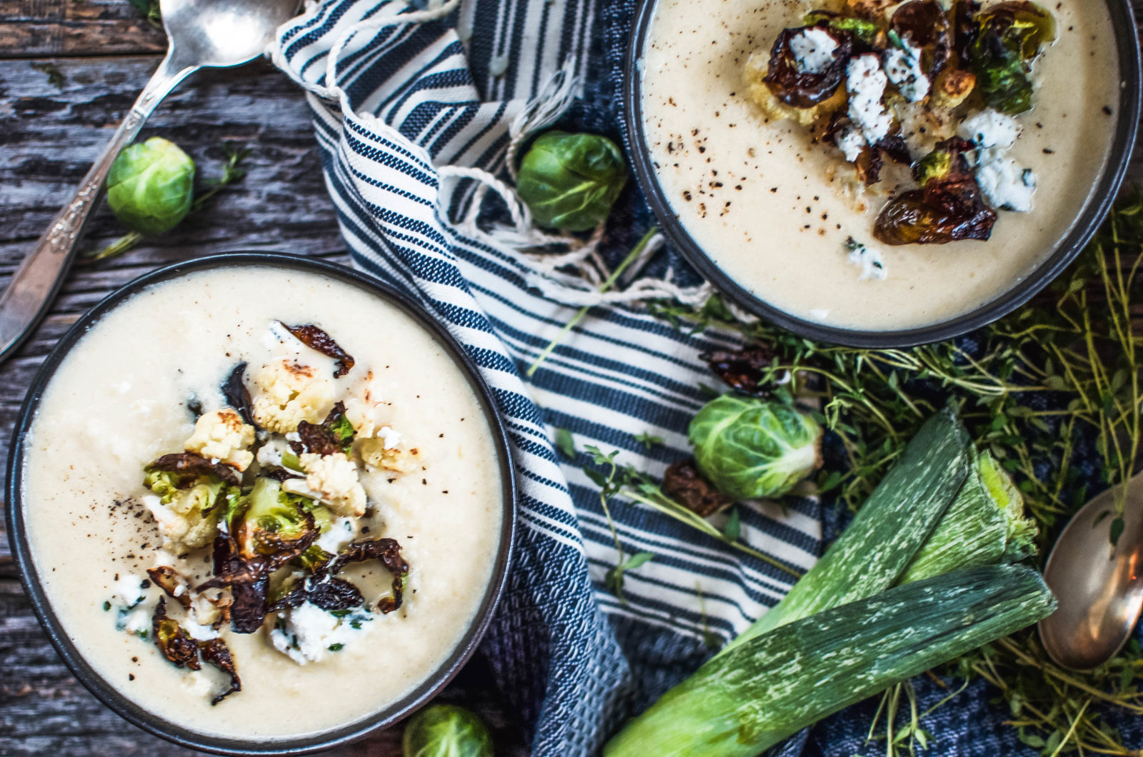 A decadent, rich cauliflower soup topped with crispy Brussels sprout leaves, cauliflower florets and herbed goat cheese.