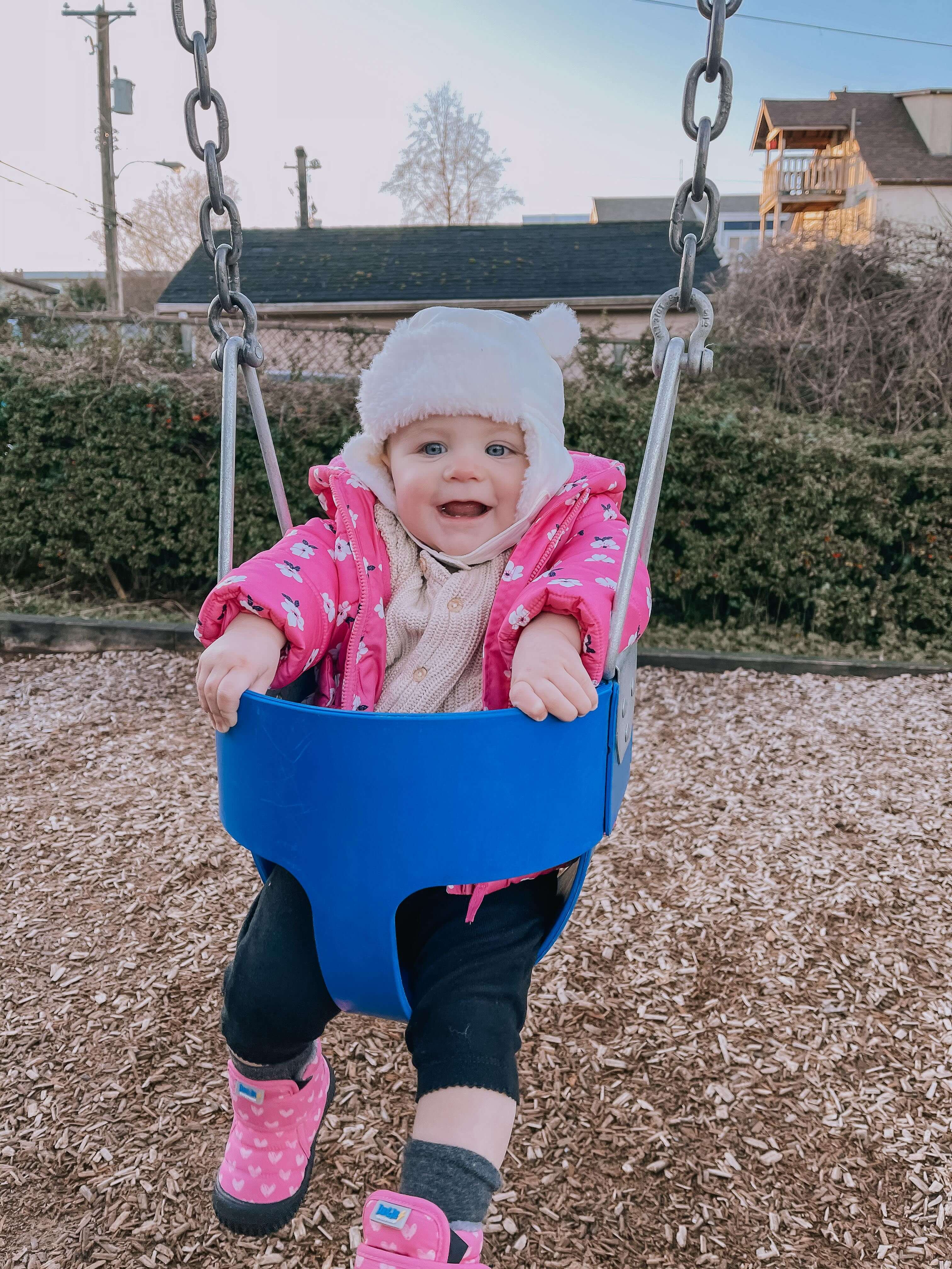 Baby on playground swing
